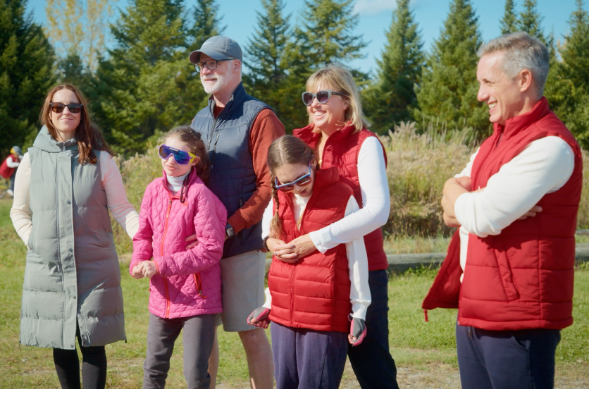 Families gathered outdoors before an adaptive biking adventure