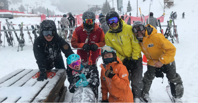 Lucy enjoying a ski day with her family