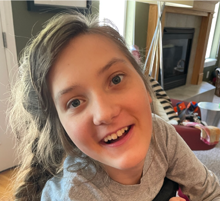 Lucy smiling and looking at camera